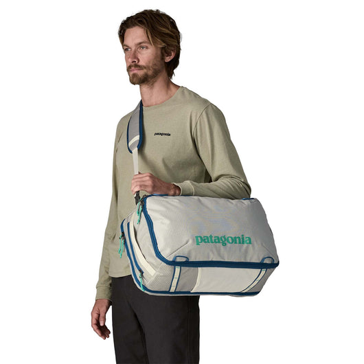 patagonia black hole mini messenger 12l white MLC 30L Noble Grey shedding reverse coil zipper Webbing strap holds your bike lock Interior sleeve holds tablets Patagonia Black Patagonia Small Bag