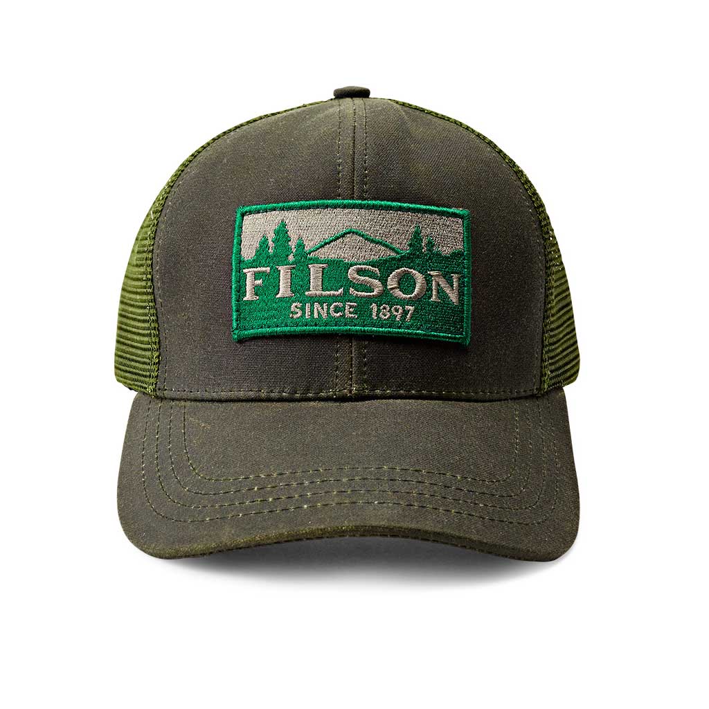 A green Filson mesh logger cap with an adjustable strap and a brass buckle, featuring the Filson logo on the front.