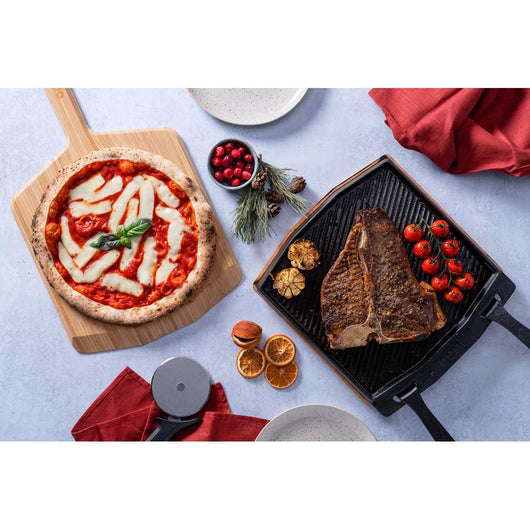 https://wildbounds.myshopify.com/cdn/shop/products/ooni-dual-sided-grizzler-plate-cast-iron-cookware-one-size-black-uu-p0a000-29829908627623_530x.jpg?v=1625289577